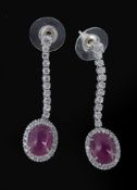 A pair of 18 carat gold ruby and diamond ear pendents  A pair of 18 carat gold ruby and diamond