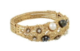 A diamond and cultured pearl flower hinged bangle  A diamond and cultured pearl flower hinged