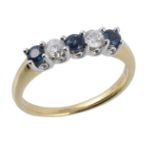 A five stone sapphire and diamond ring, the two round brilliant cut diamonds...  A five stone