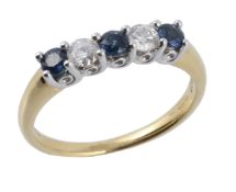 A five stone sapphire and diamond ring, the two round brilliant cut diamonds...  A five stone