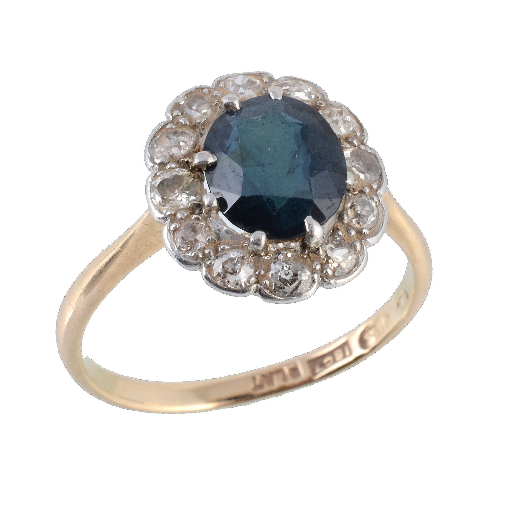 A sapphire and diamond cluster ring, the oval cut sapphire within an old cut...  A sapphire and