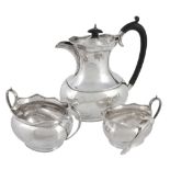 A silver three piece oblong baluster tea service, maker's mark W & G  A silver three piece oblong