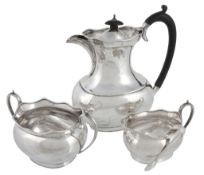 A silver three piece oblong baluster tea service, maker's mark W & G  A silver three piece oblong