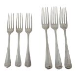 A silver set of twelve rat tail pattern table and dessert forks by Harrods Ltd  A silver set of