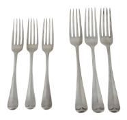 A silver set of twelve rat tail pattern table and dessert forks by Harrods Ltd  A silver set of