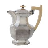 A silver and ivory canted-rectangular baluster hotwater pot by Viners  A silver and ivory canted-