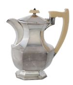 A silver and ivory canted-rectangular baluster hotwater pot by Viners  A silver and ivory canted-