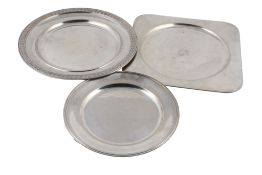 Two Italian silver coloured circular plates and a rounded square example  Two Italian silver