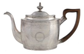 A George III silver oval teapot, maker's mark GB over striking that of another  A George III