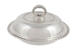 An Italian silver coloured circular vegetable dish, cover and handle, 1944-68  An Italian silver