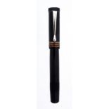 Soennecken, a black safety pen, with a black cap and barrel  Soennecken, a black safety pen,