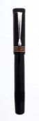 Soennecken, a black safety pen, with a black cap and barrel  Soennecken, a black safety pen,