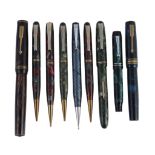 A small selection of writing instruments, including  A small selection of writing instruments,