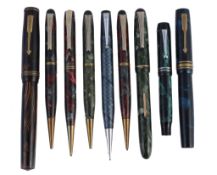 A small selection of writing instruments, including  A small selection of writing instruments,