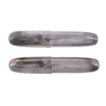 A silver coloured torpedo shaped fountain pen and ball point pen  A silver coloured torpedo shaped