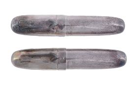 A silver coloured torpedo shaped fountain pen and ball point pen  A silver coloured torpedo shaped