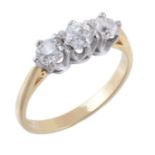 A diamond three stone ring, set with three old brilliant cut diamonds  A diamond three stone ring,