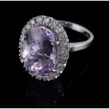 An 18 carat gold kunzite and diamond cluster ring  An 18 carat gold kunzite and diamond cluster