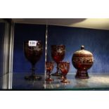 A selection of ruby-flashed glass, to include five glasses and a pot with cover -6 Best Bid