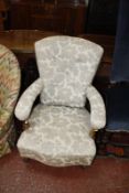 A Victorian walnut and upholstered open armchair
