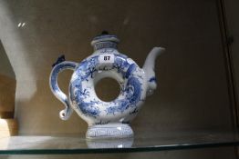 A modern Chinese blue and white teapot, ring shaped, 25cm high