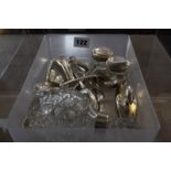 Twelve assorted silver teaspoons, a nail buffer, silver lidded pots and a mounted perfume bottle