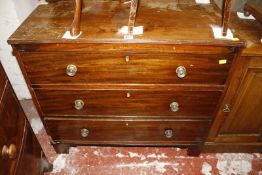 A Victorian mahogany pot cupboard and a late Georgian mahogany chest with three long drawers