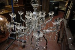 A 19th century style fifteen branch glass chandelier with drop pendants, 70cm long approx. (sold