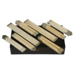 Eight assorted ivory and bone rules, various makers, in wooden box