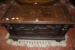 A Continental 19th Century blanket box, the top inlaid with a stag and the front with carved