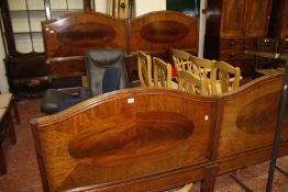 A pair of Edwardian mahogany single beds, bearing plaques 'HEAL & SON' to the headboard