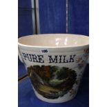 A Continental pottery twin handled milk pail, decorated with printed central image of cattle in