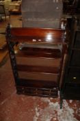 A mahogany open bookcase with fretwork sides 110cm high, 66cm wide