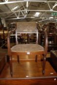 A Regency mahogany and cane armchair