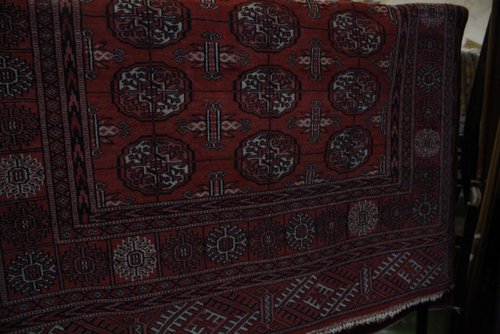An Afghan style red ground rug 171 x 126cm