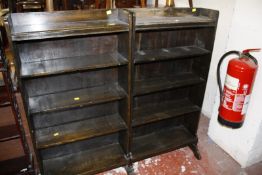 A pair of stained oak dwarf bookcases each 62cm wide