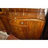A mahogany serpentine front dining room side cabinet, circa 1925 123cm wide