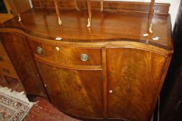 A mahogany serpentine front dining room side cabinet, circa 1925 123cm wide