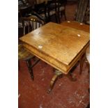 A 19th century walnut and marquetry work table on column support and splayed legs.