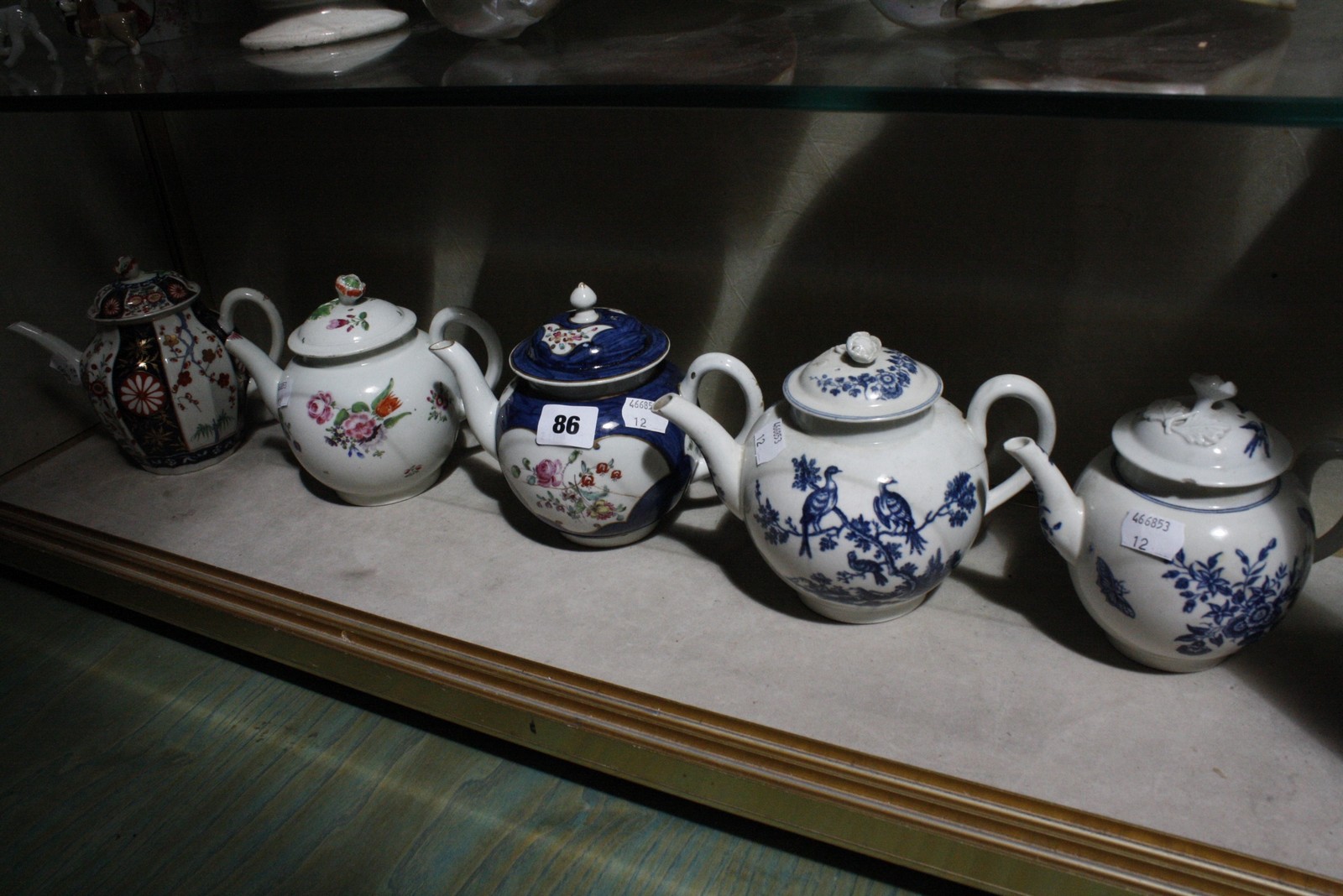 Assorted tea pots to include two Worcester tea pots with blue crescent mark to base (AF), a