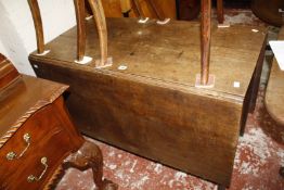 A 19th Century oak drop leaf dining table Best Bid