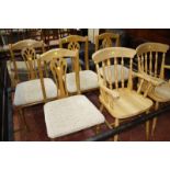 A pair of beech kitchen armchairs, together with a set of four pine chairs