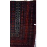 A Beluchi prayer rug in red, black and white- 61x 109 cms Best Bid