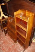 A George III mahogany two tier washstand, an Edwardian mahogany open bookcase, a modern occasional