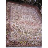 A Heriz carpet with central medallion and allover decoration approx 13 x 12 foot