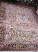 A Heriz carpet with central medallion and allover decoration approx 13 x 12 foot