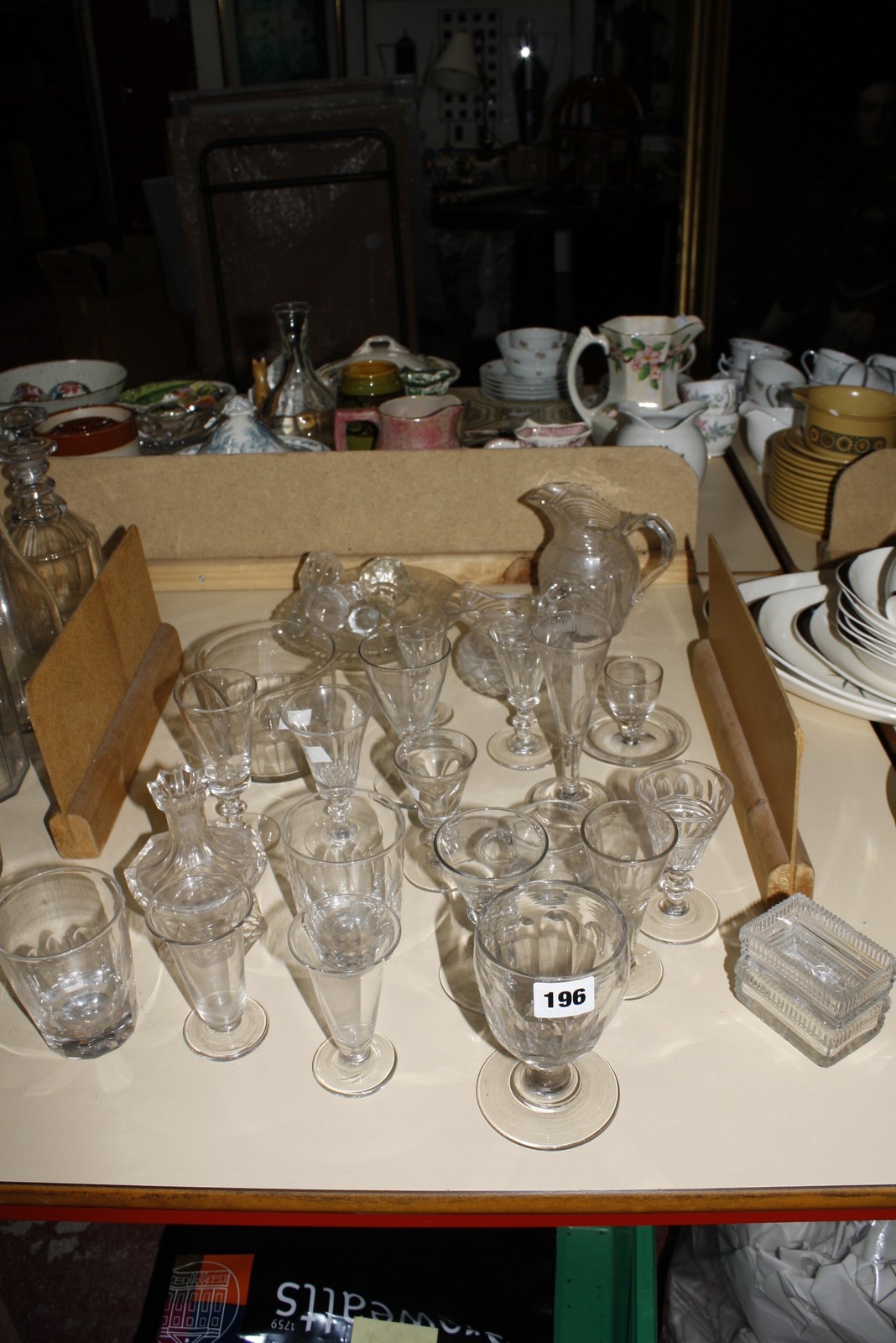 A quantity of 18th/ 19th Century glassware to include Regency cream jugs, wines and other items