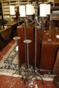 A pair of tall metal candlebra each with four pricket candle holders-152 cms and a pair of single