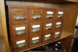 * An oak twelve drawer chest, 48.5cm wide