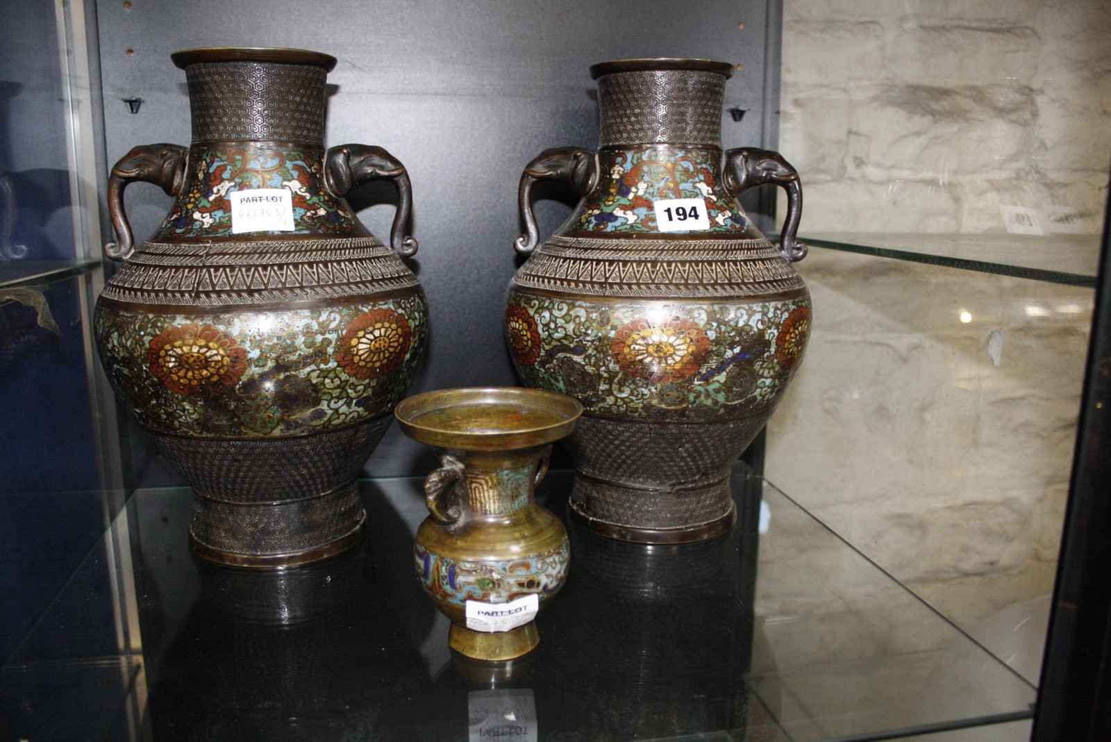 A pair of 19th century cloisonné vases with elephant mask handles, 30cm high and a smaller cloisonné